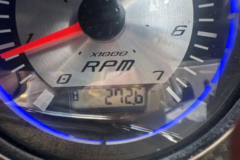 Slide: The Image of Tachometer of 2017 Stingray 235 LR showing 212.6 hours with blue backlight. - 53