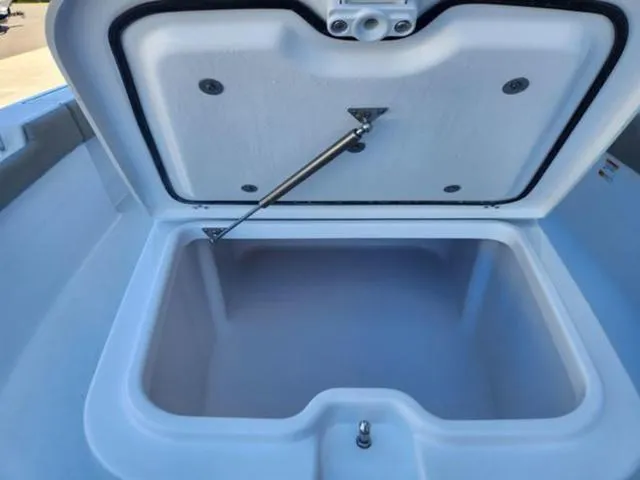 Slide: The Image of Open storage compartment in 2025 Sportsman MASTERS 247OE boat. - 10