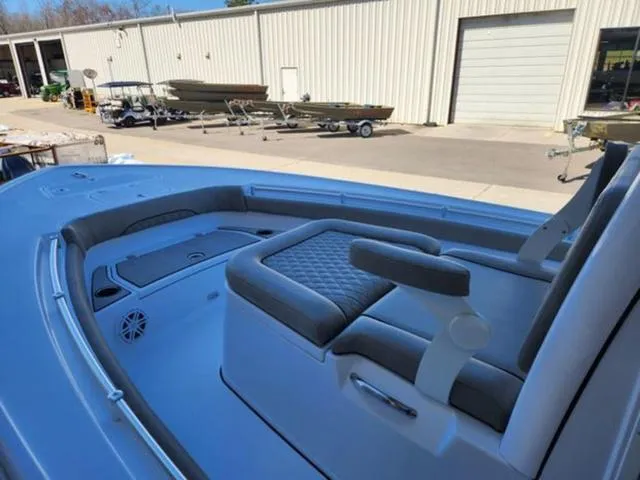 Slide: The Image of 2025 Sportsman MASTERS 247OE boat interior with cushioned seating and storage compartments. - 3