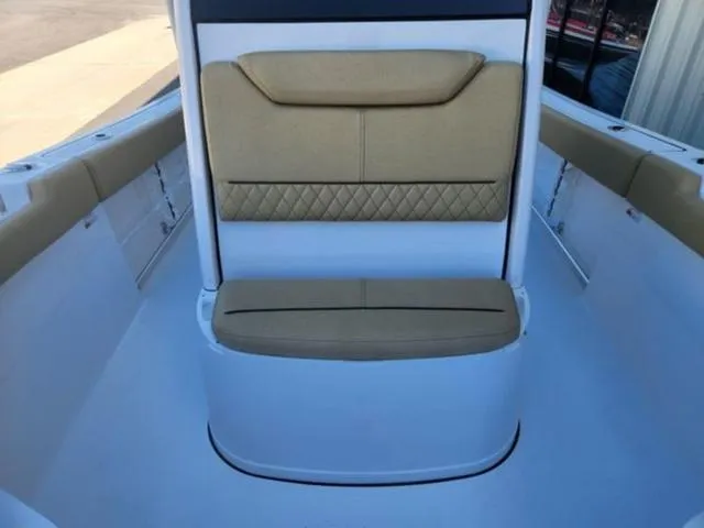 Slide: The Image of 2025 Sportsman Heritage 231 boat interior with tan cushioned seating. - 15