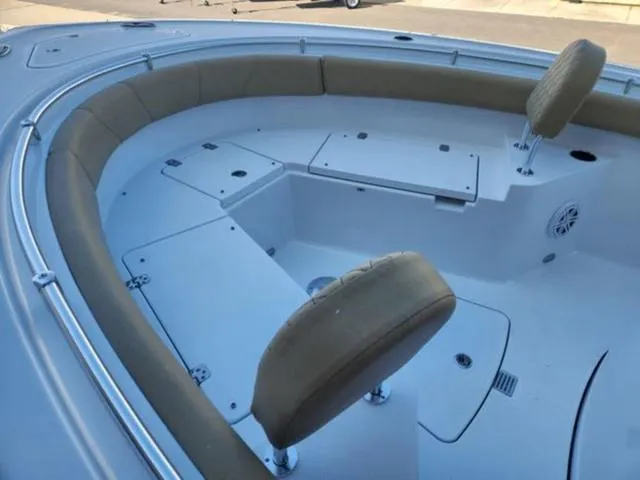 Slide: The Image of 2025 Sportsman Heritage 231 boat interior with cushioned seating and storage compartments. - 19