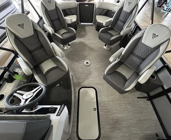 Slide: The Image of 2025 VIAGGIO by Misty Harbor Z22Q boat interior with modern seating and steering wheel. - 4