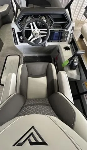 Slide: The Image of 2025 VIAGGIO by Misty Harbor Z22Q boat cockpit with modern steering and controls. - 5