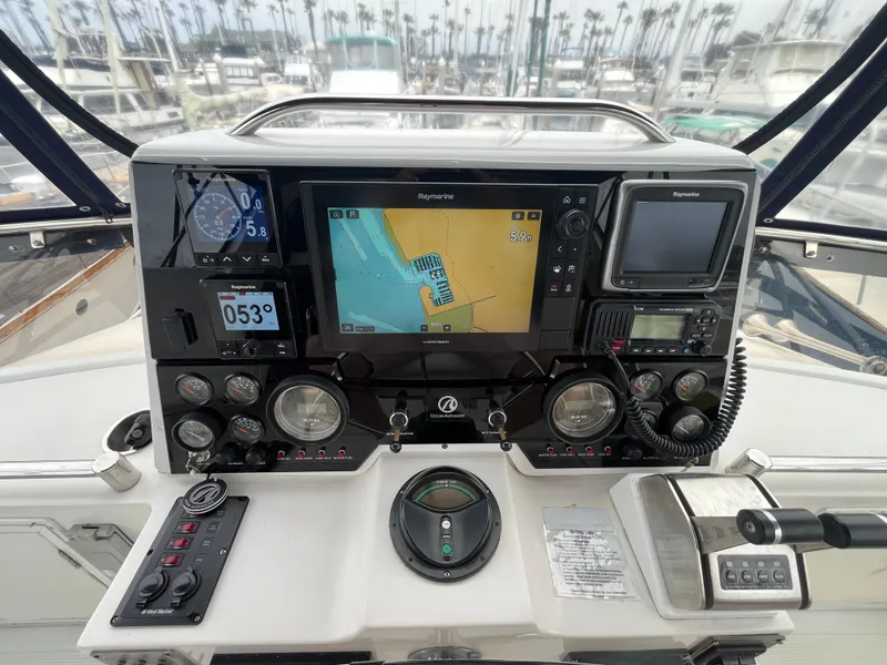 Slide: The Image of Cockpit of 1999 Ocean Alexander Sundeck 460 with navigation instruments and controls. - 15
