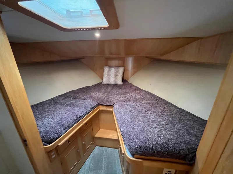 Slide: The Image of 1999 Ocean Alexander Sundeck 460 cabin with cozy twin beds and wooden interior. - 34
