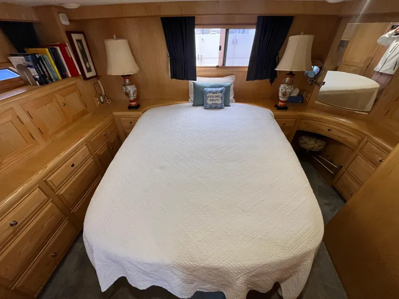 Slide: The Image of 1999 Ocean Alexander Sundeck 460 bedroom with cozy bed, wooden cabinets, and nautical decor. - 37