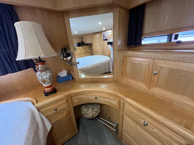Slide: The Image of Interior of 1999 Ocean Alexander Sundeck 460 with wooden cabinetry and decorative lamp. - 39