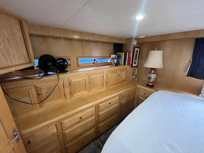 Slide: The Image of Cozy cabin interior of 1999 Ocean Alexander Sundeck 460 with wooden cabinetry and soft lighting. - 40