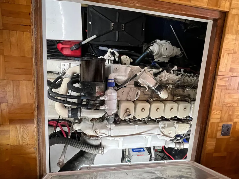 Slide: The Image of Engine compartment of a 1999 Ocean Alexander Sundeck 460 yacht, showcasing mechanical components. - 46