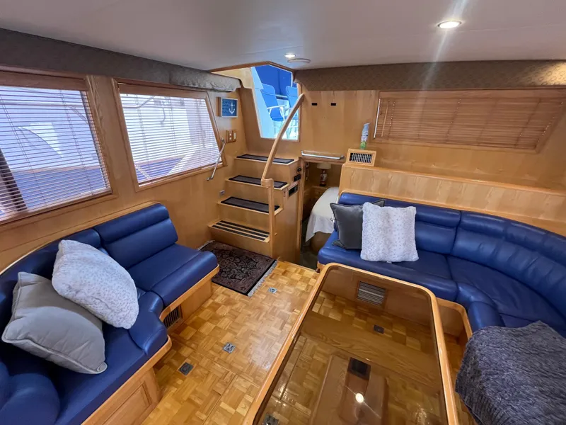 Slide: The Image of Luxurious interior of 1999 Ocean Alexander Sundeck 460 yacht with blue leather seating. - 19