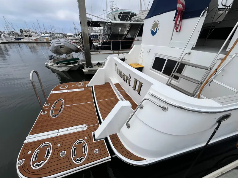 Slide: The Image of Ocean Alexander Sundeck 460 yacht, 1999 model, docked with wooden deck and marina view. - 4