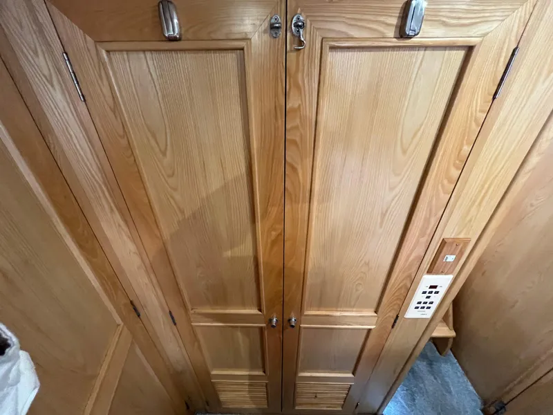 Slide: The Image of Wooden cabinet doors on 1999 Ocean Alexander Sundeck 460 yacht interior. - 43