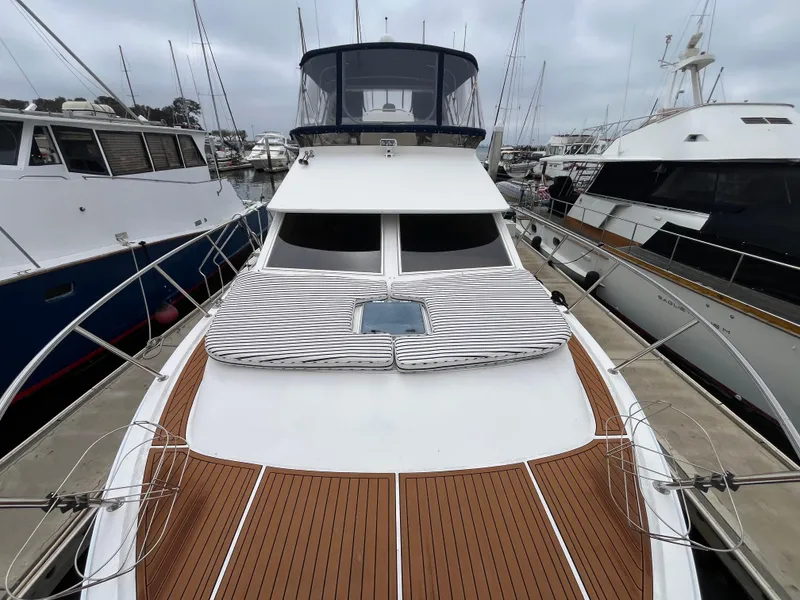 Slide: The Image of Ocean Alexander Sundeck 460, 1999 model, docked with teak deck and striped sun pads. - 8