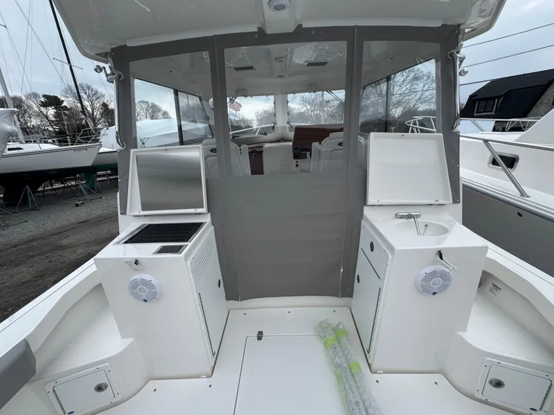 Slide: The Image of 2025 NorthCoast 315 HT boat interior with seating and storage compartments. - 3