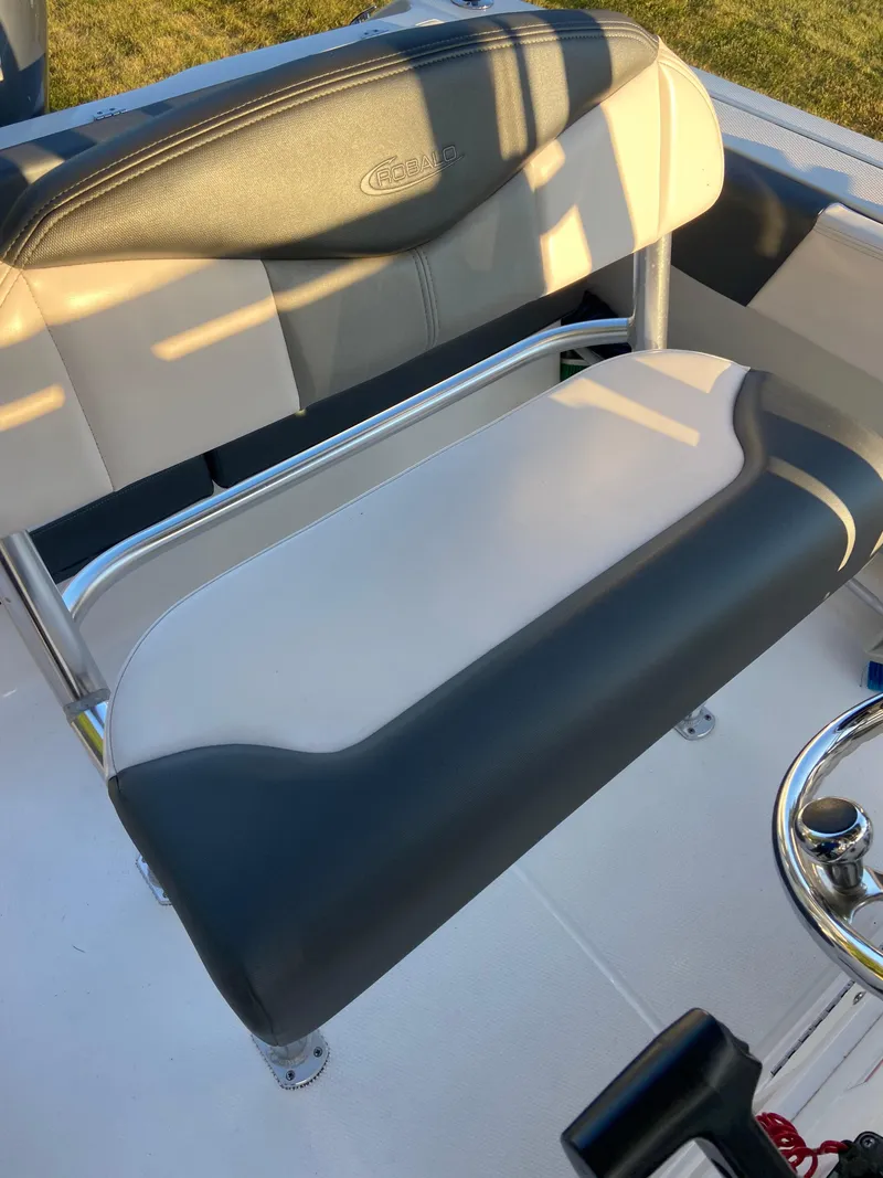 Slide: The Image of 2020 Robalo R202 EX boat seat with gray and white upholstery. - 5