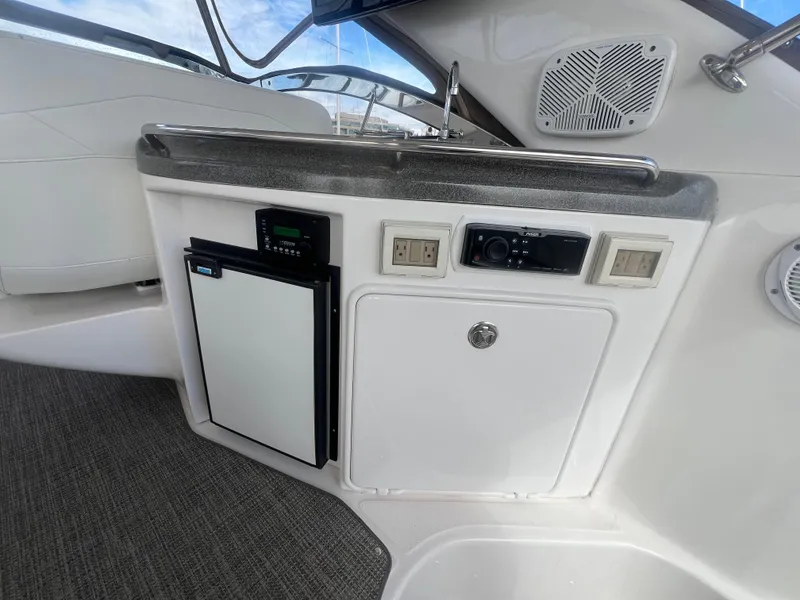 Slide: The Image of 2007 Regal Commodore 4060 yacht interior with mini fridge and control panel. - 10