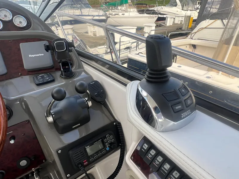 Slide: The Image of Control panel of a 2007 Regal Commodore 4060 yacht with navigation equipment. - 13