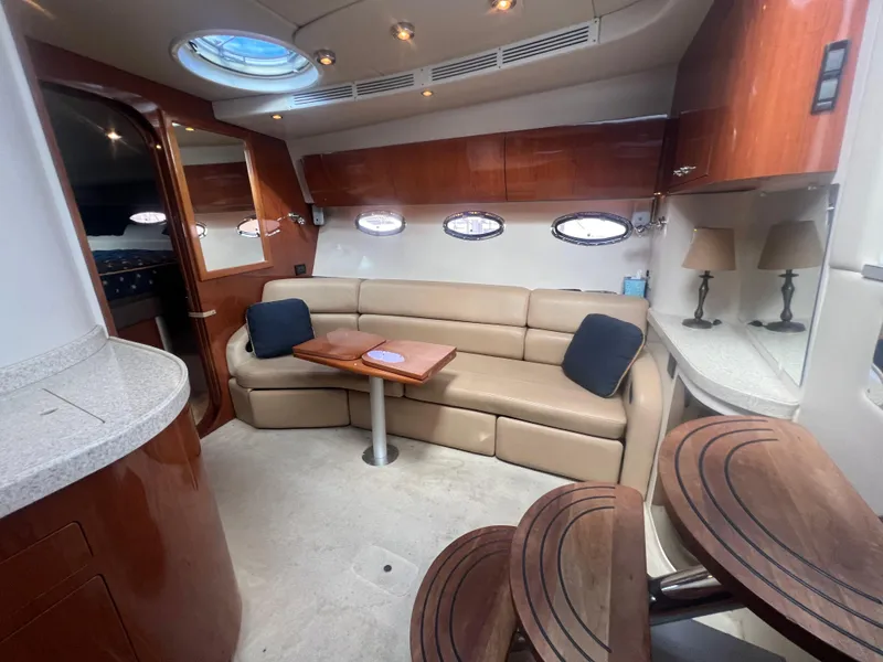 Slide: The Image of Interior of 2007 Regal Commodore 4060 yacht with beige seating and wooden accents. - 15