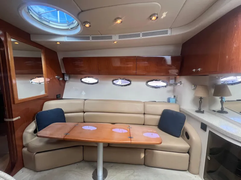 Slide: The Image of Luxurious 2007 Regal Commodore 4060 yacht interior with plush seating and elegant wood finishes. - 18