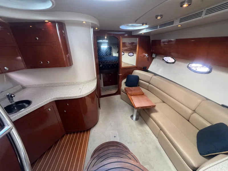 Slide: The Image of Luxurious interior of a 2007 Regal Commodore 4060 yacht with elegant seating and cabinetry. - 19