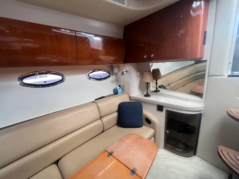 Slide: The Image of Interior of 2007 Regal Commodore 4060 yacht with beige seating and wooden cabinets. - 20
