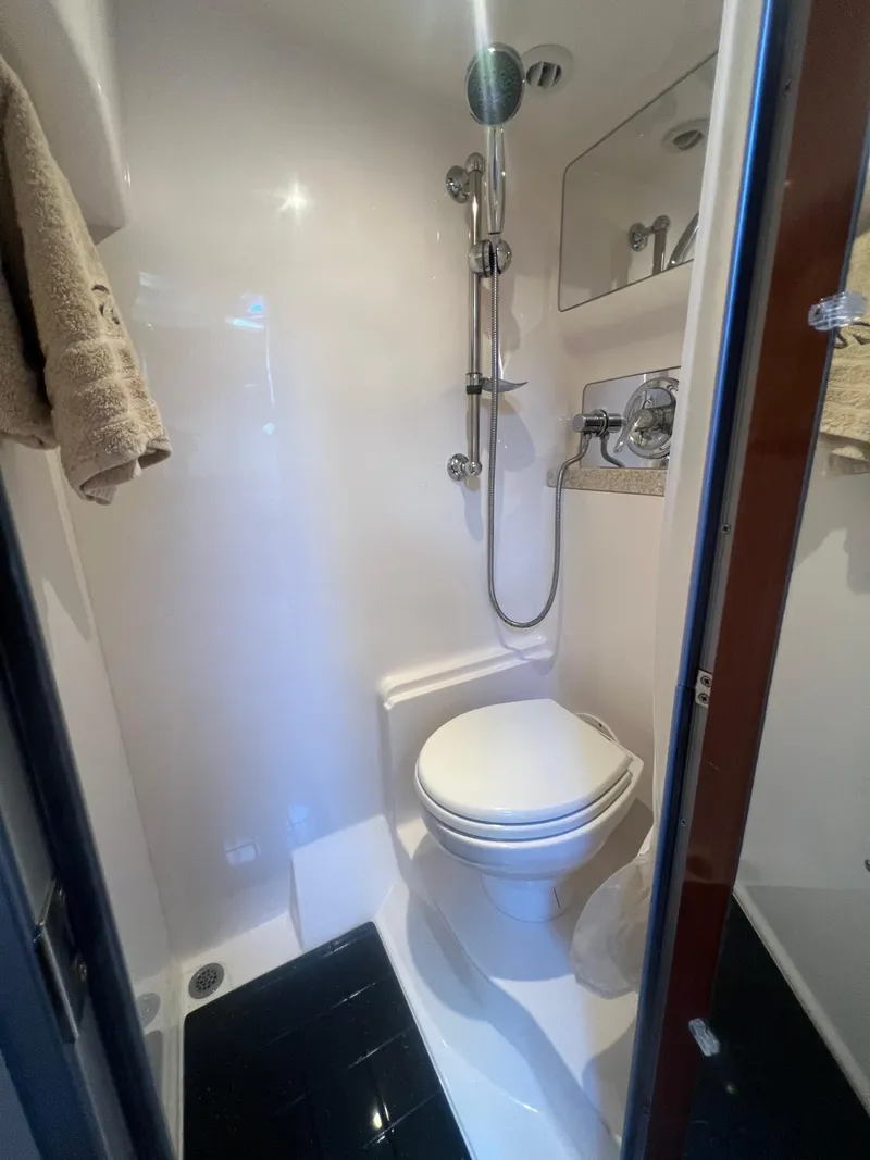 Slide: The Image of Compact bathroom in 2007 Regal Commodore 4060 yacht with shower and toilet. - 22
