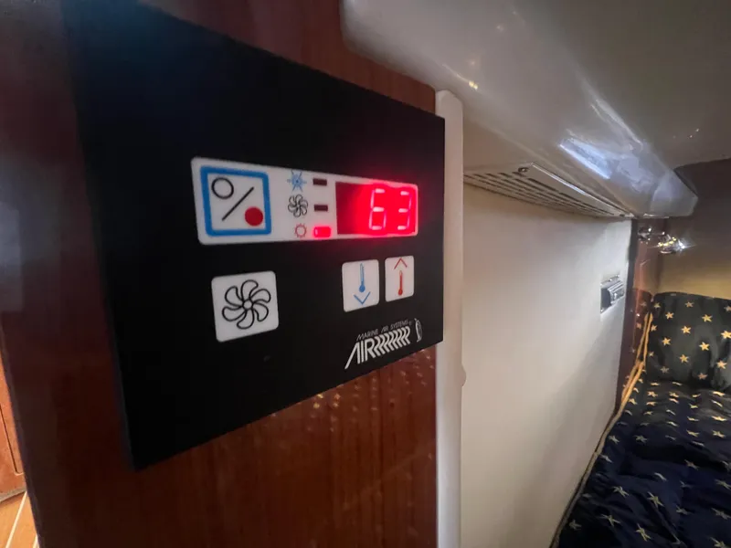 Slide: The Image of Control panel inside 2007 Regal Commodore 4060 yacht, displaying temperature at 63 degrees. - 25
