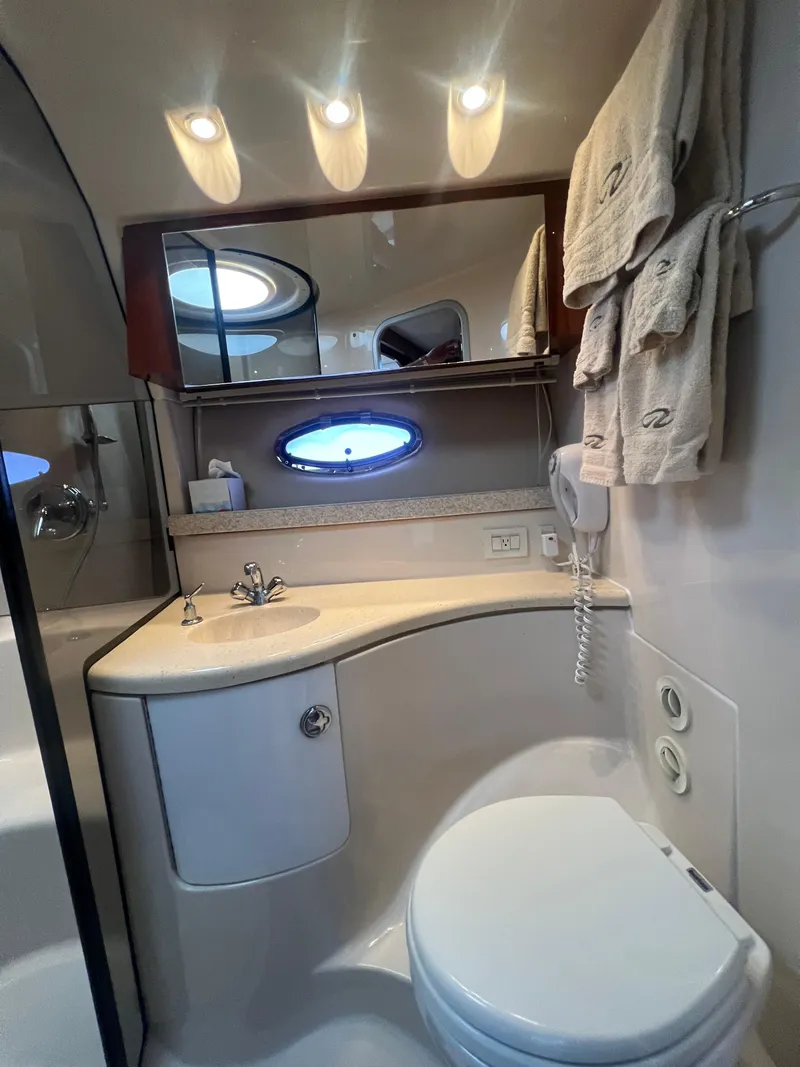 Slide: The Image of Luxurious bathroom in 2007 Regal Commodore 4060 yacht with modern fixtures and elegant lighting. - 26