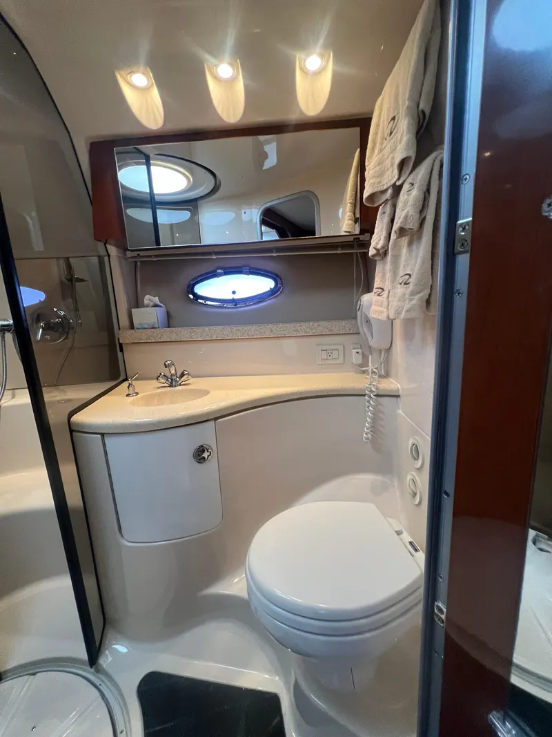 Slide: The Image of Luxurious bathroom in 2007 Regal Commodore 4060 yacht with modern fixtures and elegant design. - 29