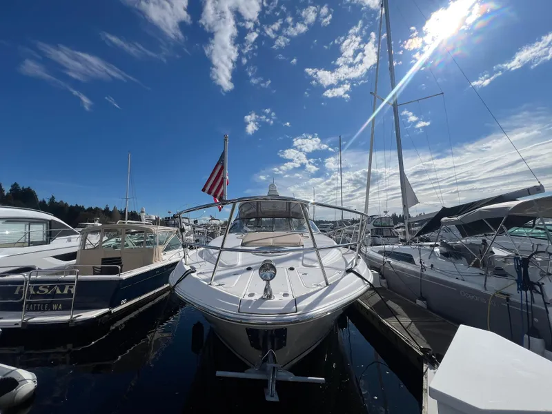 Slide: The Image of 2007 Regal Commodore 4060 yacht docked under a bright blue sky. - 3