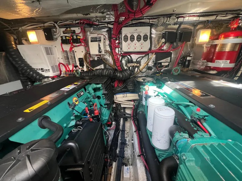 Slide: The Image of Engine room of a 2007 Regal Commodore 4060, showcasing complex wiring and machinery. - 34