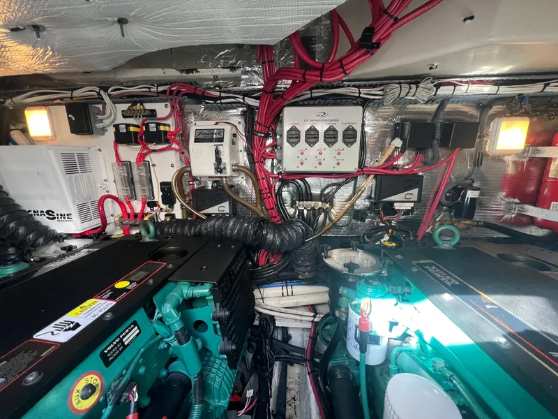 Slide: The Image of Engine room of 2007 Regal Commodore 4060 with complex wiring and machinery. - 35