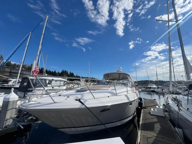 Slide: The Image of 2007 Regal Commodore 4060 yacht docked under a clear blue sky. - 4