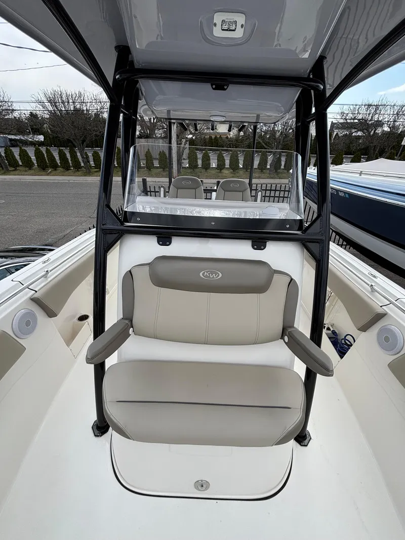 Slide: The Image of 2023 Key West 263FS boat interior with seating and console. - 14