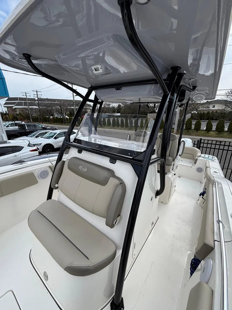 Slide: The Image of 2023 Key West 263FS boat with sleek design and comfortable seating. - 15