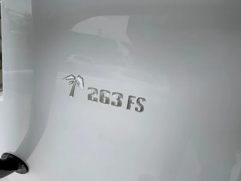 Slide: The Image of 2023 Key West 263FS boat emblem on white surface. - 17