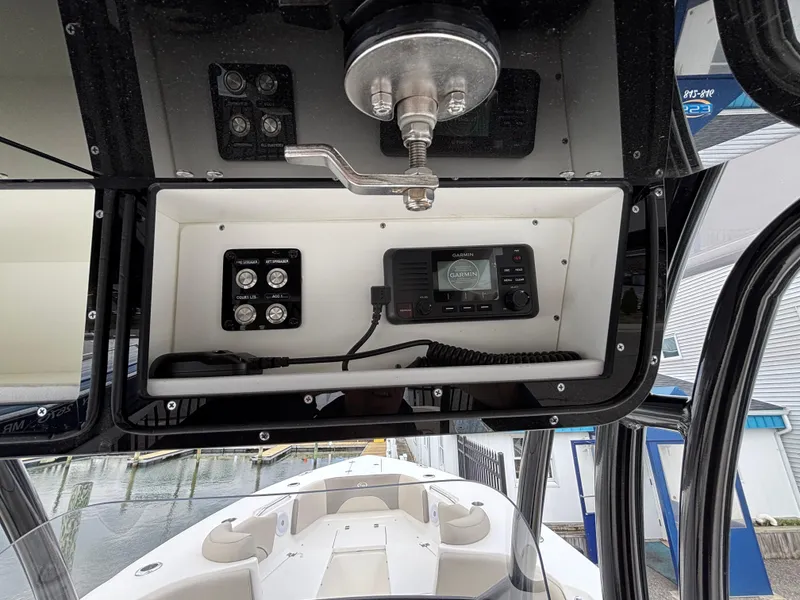 Slide: The Image of 2023 Key West 263FS boat console with radio and control panel. - 27