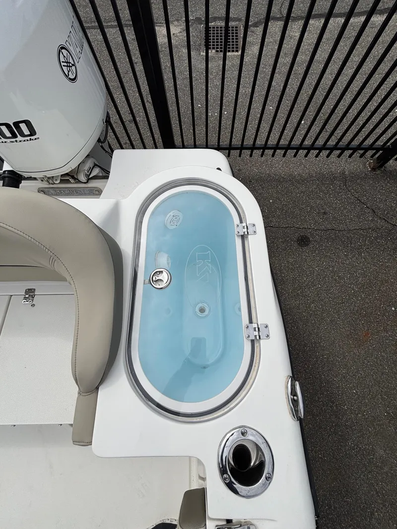 Slide: The Image of 2023 Key West 263FS boat with livewell and seating area. - 28