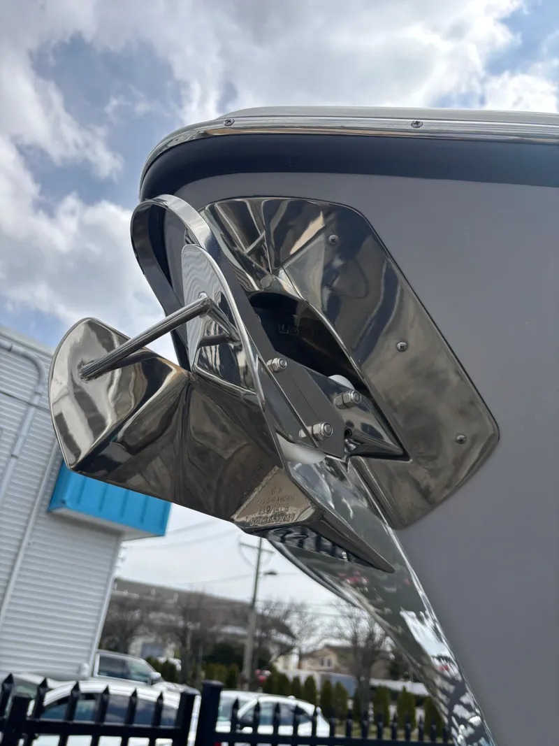 Slide: The Image of 2023 Key West 263FS boat anchor detail under cloudy sky. - 31