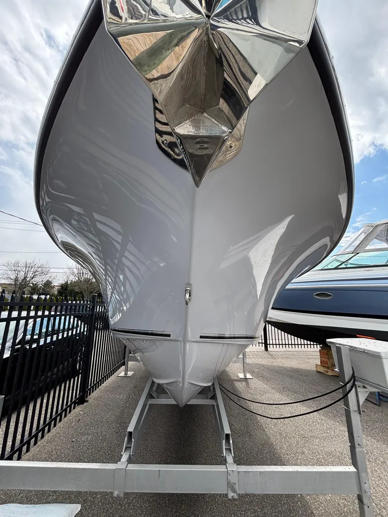 Slide: The Image of 2023 Key West 263FS boat on trailer, showcasing sleek hull design. - 33