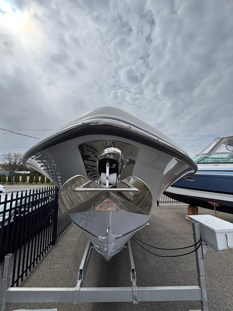 Slide: The Image of 2023 Key West 263FS boat on trailer under cloudy sky. - 5