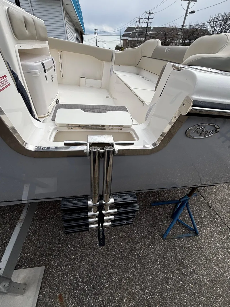 Slide: The Image of 2023 Key West 263FS boat with swim ladder and seating area. - 7