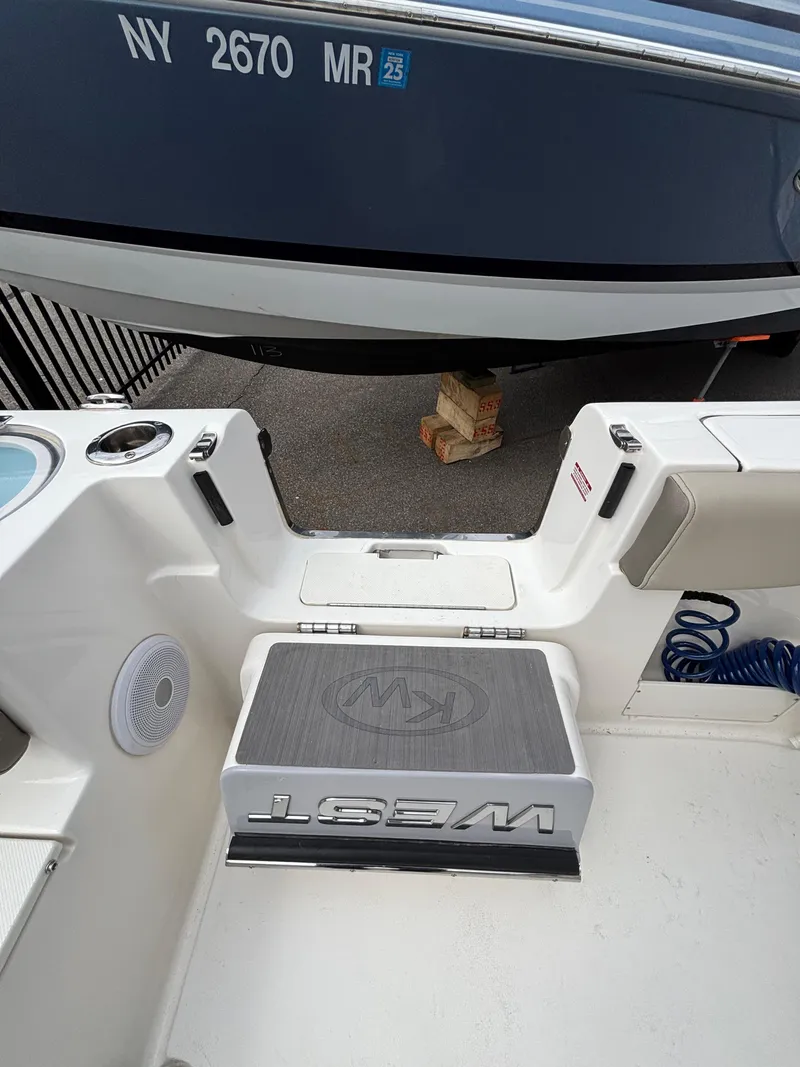 Slide: The Image of 2023 Key West 263FS boat interior with seating and storage. - 8