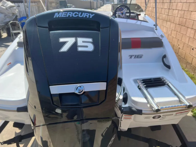 Slide: The Image of 2022 Tahoe T16 boat with Mercury 75 engine, rear view. - 13