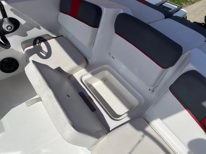 Slide: The Image of 2022 Tahoe T16 boat interior with seating and storage compartment. - 5