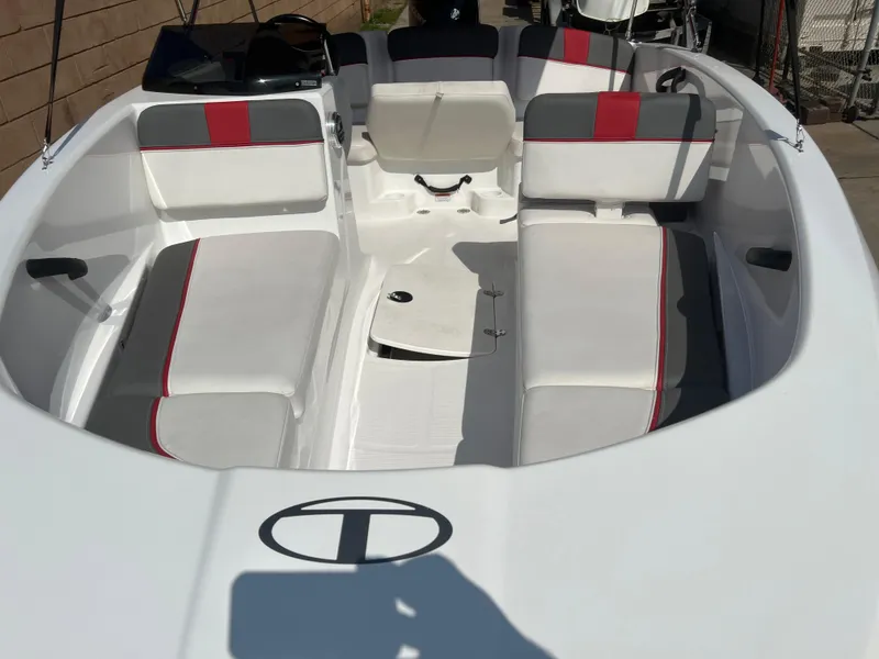 Slide: The Image of 2022 Tahoe T16 boat interior with white and red seating, spacious layout. - 8