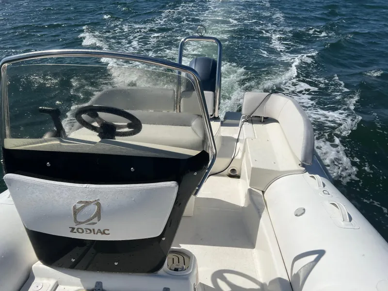 Slide: The Image of 2020 Zodiac N-ZO 600 boat navigating on open water, rear view. - 12