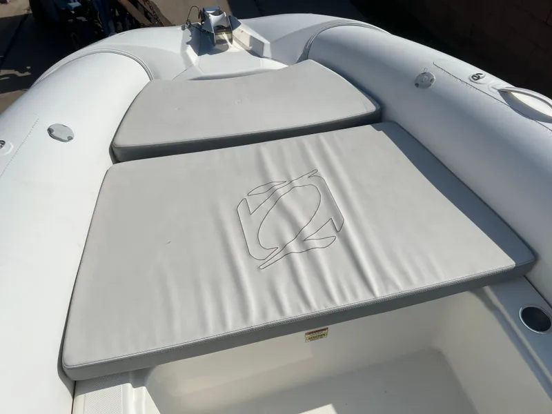 Slide: The Image of 2020 Zodiac N-ZO 600 boat with cushioned seating and sleek design. - 13