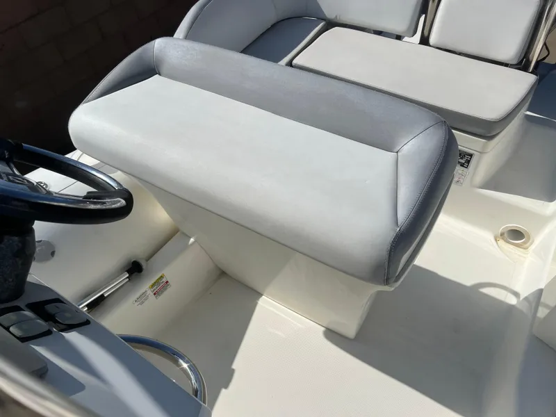 Slide: The Image of 2020 Zodiac N-ZO 600 boat interior with gray seating and steering wheel. - 16