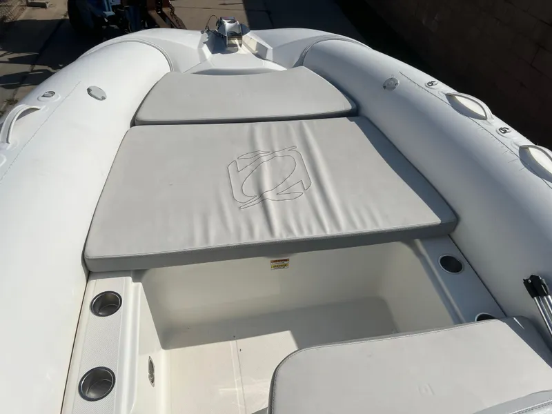 Slide: The Image of 2020 Zodiac N-ZO 600 inflatable boat with cushioned seating and storage compartment. - 19